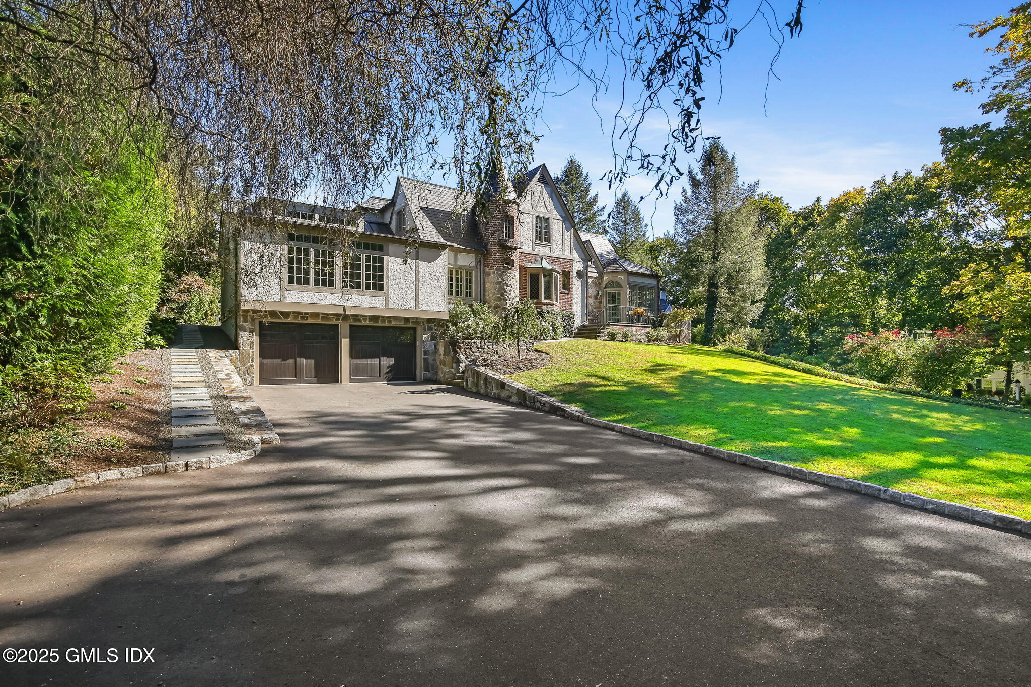 7 Stanwich Road Greenwich, CT 06830 - Photo 2 of 38 a front view of a house with a yard