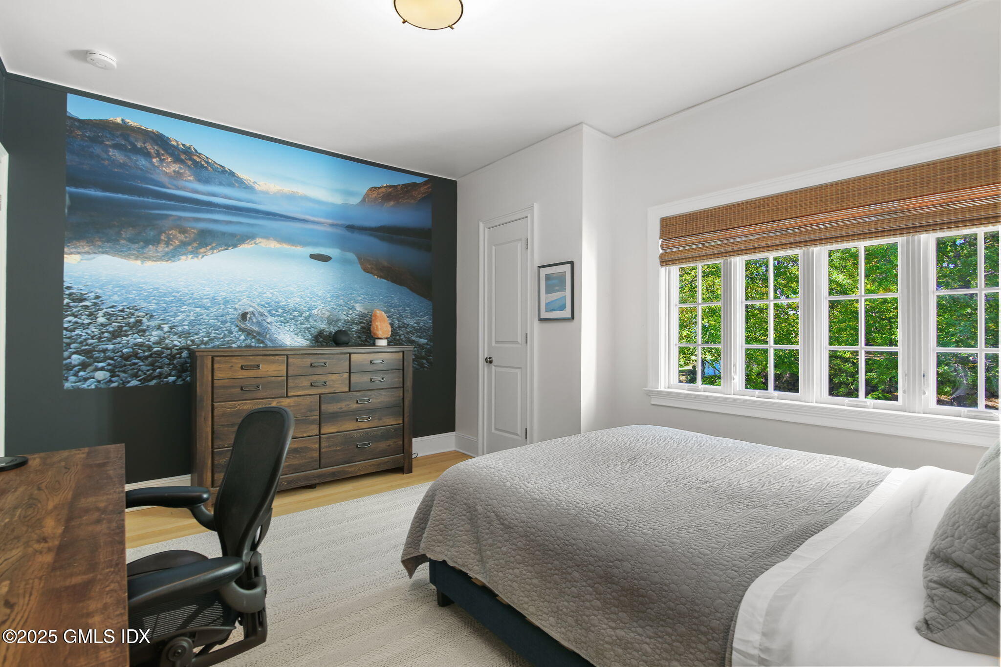 7 Stanwich Road Greenwich, CT 06830 - Photo 23 of 38 a bedroom with a bed a chair and large window