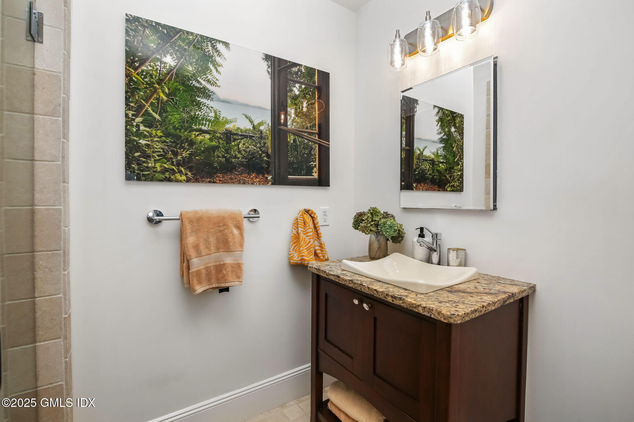 7 Stanwich Road Greenwich, CT 06830 - Photo 24 of 38 a bathroom with a sink and a mirror