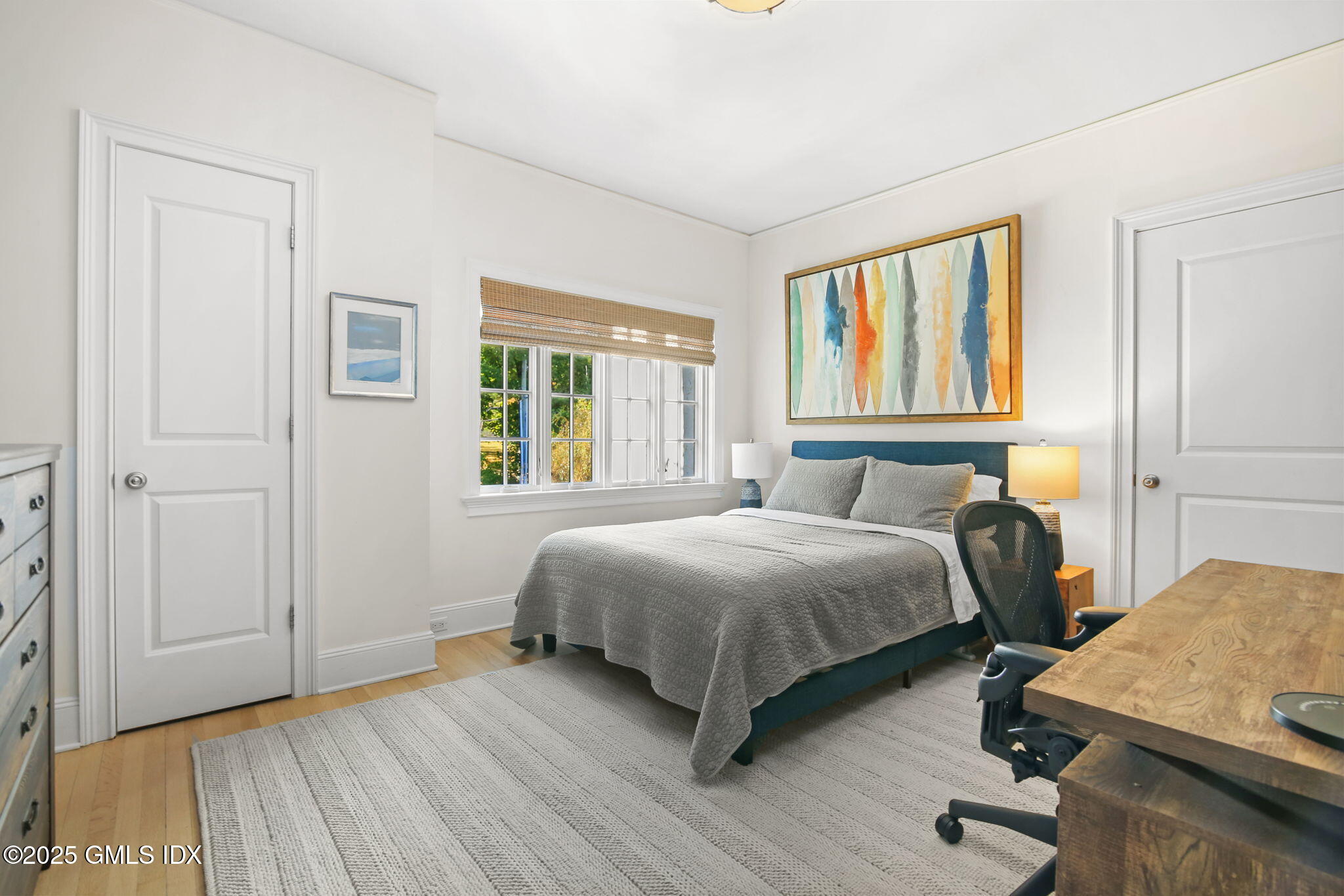 7 Stanwich Road Greenwich, CT 06830 - Photo 25 of 38 a bedroom with a bed and wooden floor