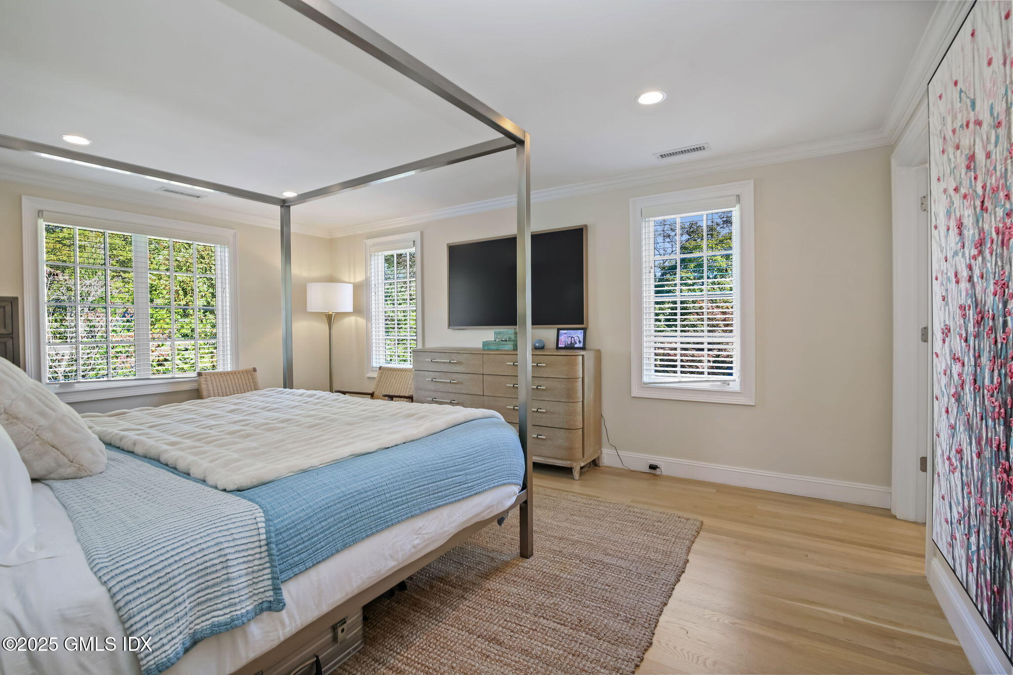 7 Stanwich Road Greenwich, CT 06830 - Photo 26 of 38 a bedroom with a large bed and a flat tv screen