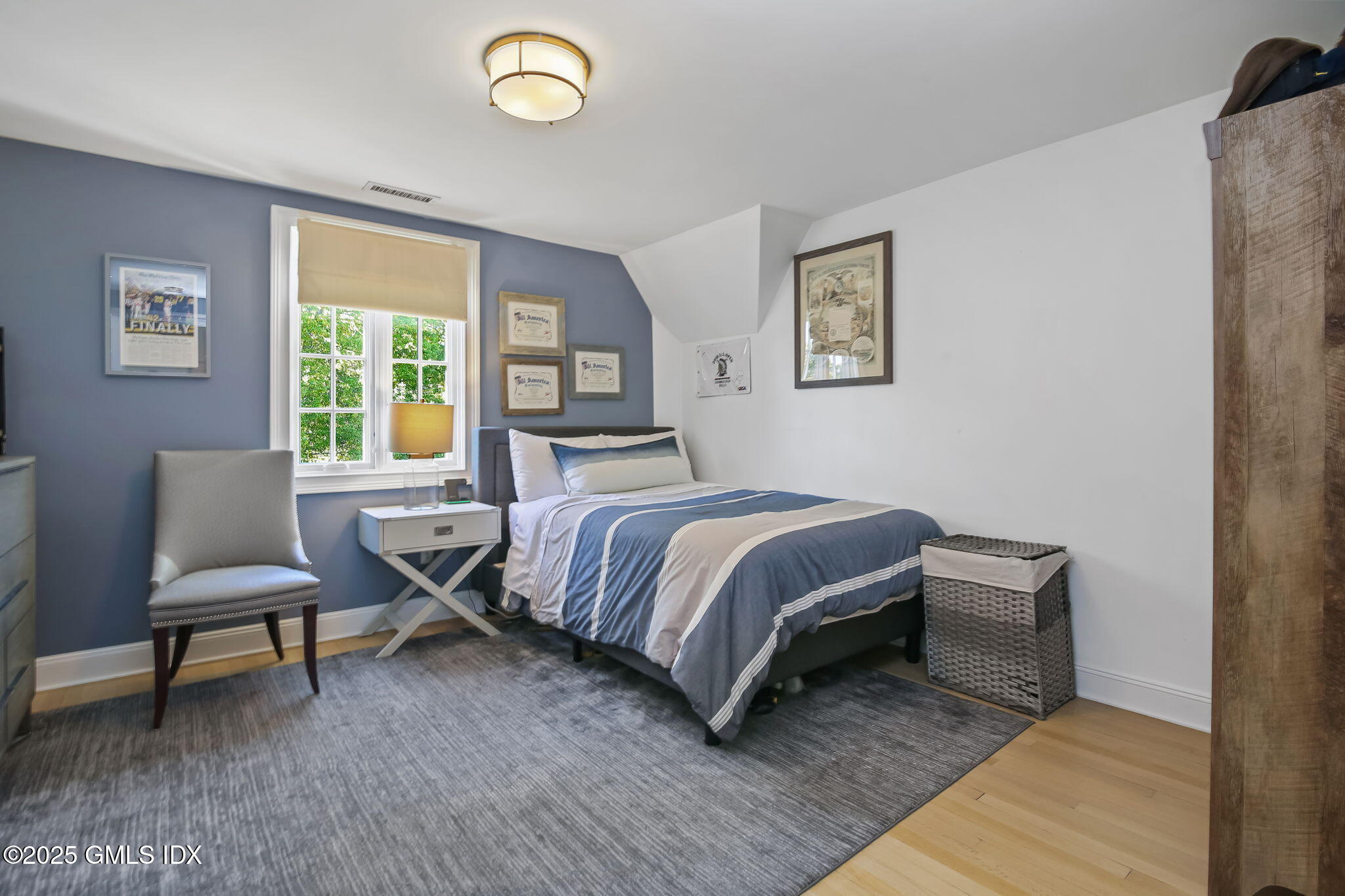 7 Stanwich Road Greenwich, CT 06830 - Photo 27 of 38 a bedroom with a bed and a window