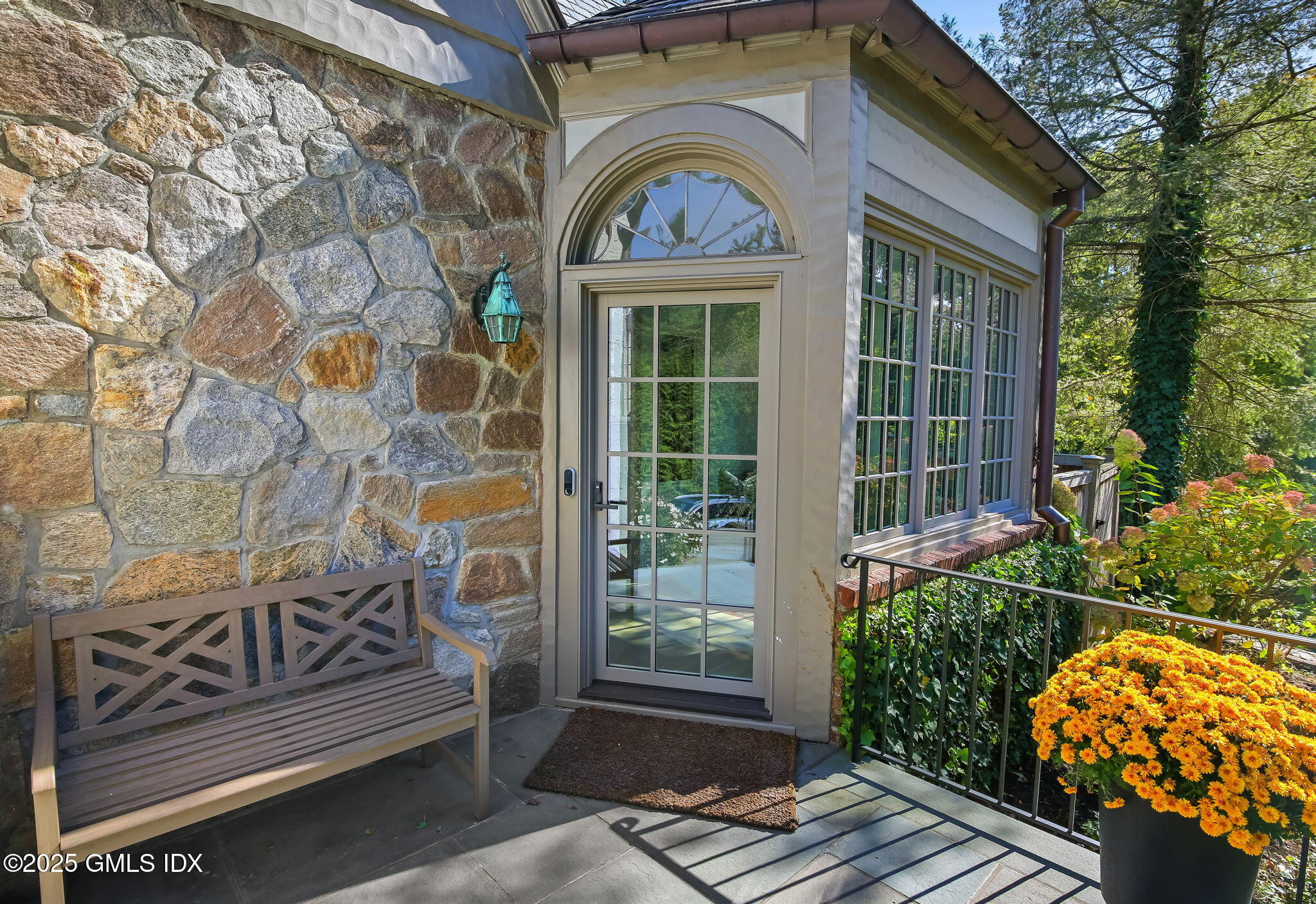 7 Stanwich Road Greenwich, CT 06830 - Photo 3 of 38 a view of a brick house with a large window