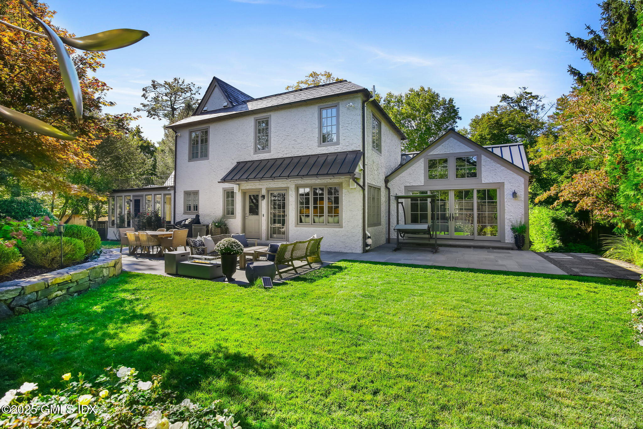 7 Stanwich Road Greenwich, CT 06830 - Photo 31 of 38 a view of a house with sitting area and garden