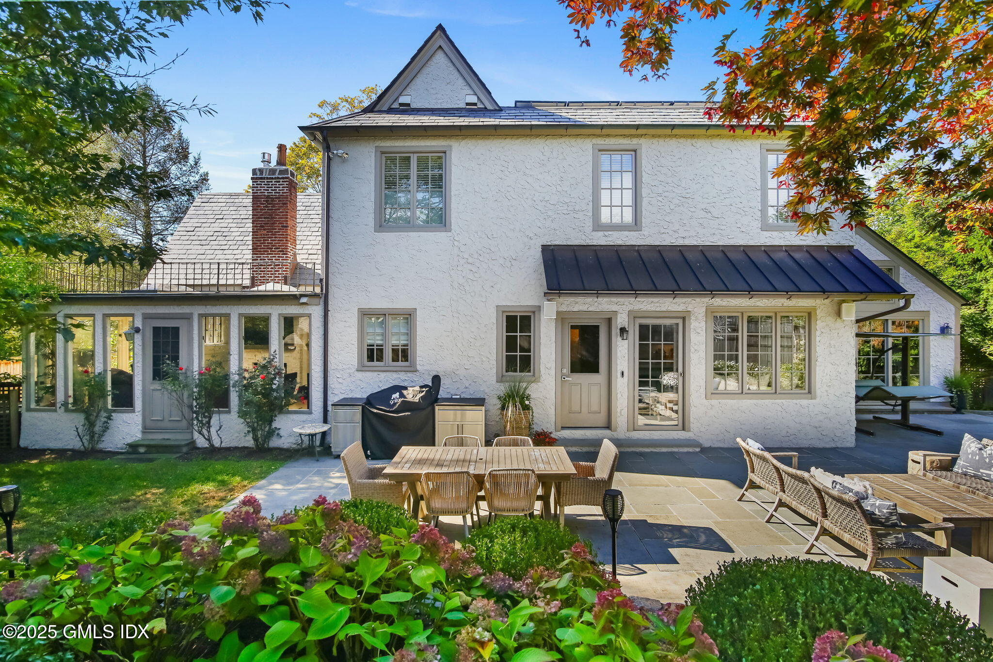 7 Stanwich Road Greenwich, CT 06830 - Photo 32 of 38 a front view of house with yard and outdoor seating