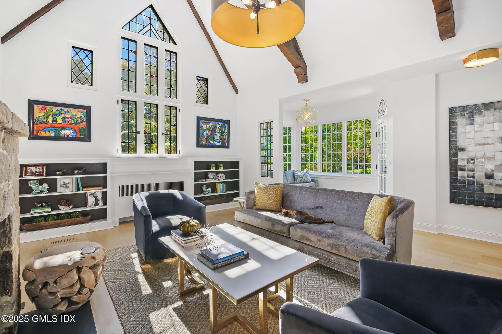 7 Stanwich Road Greenwich, CT 06830 - Photo 7 of 38 a living room with furniture a fireplace and a large window