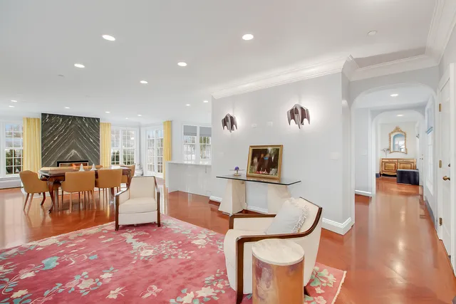 a living room with furniture a window and a dining table