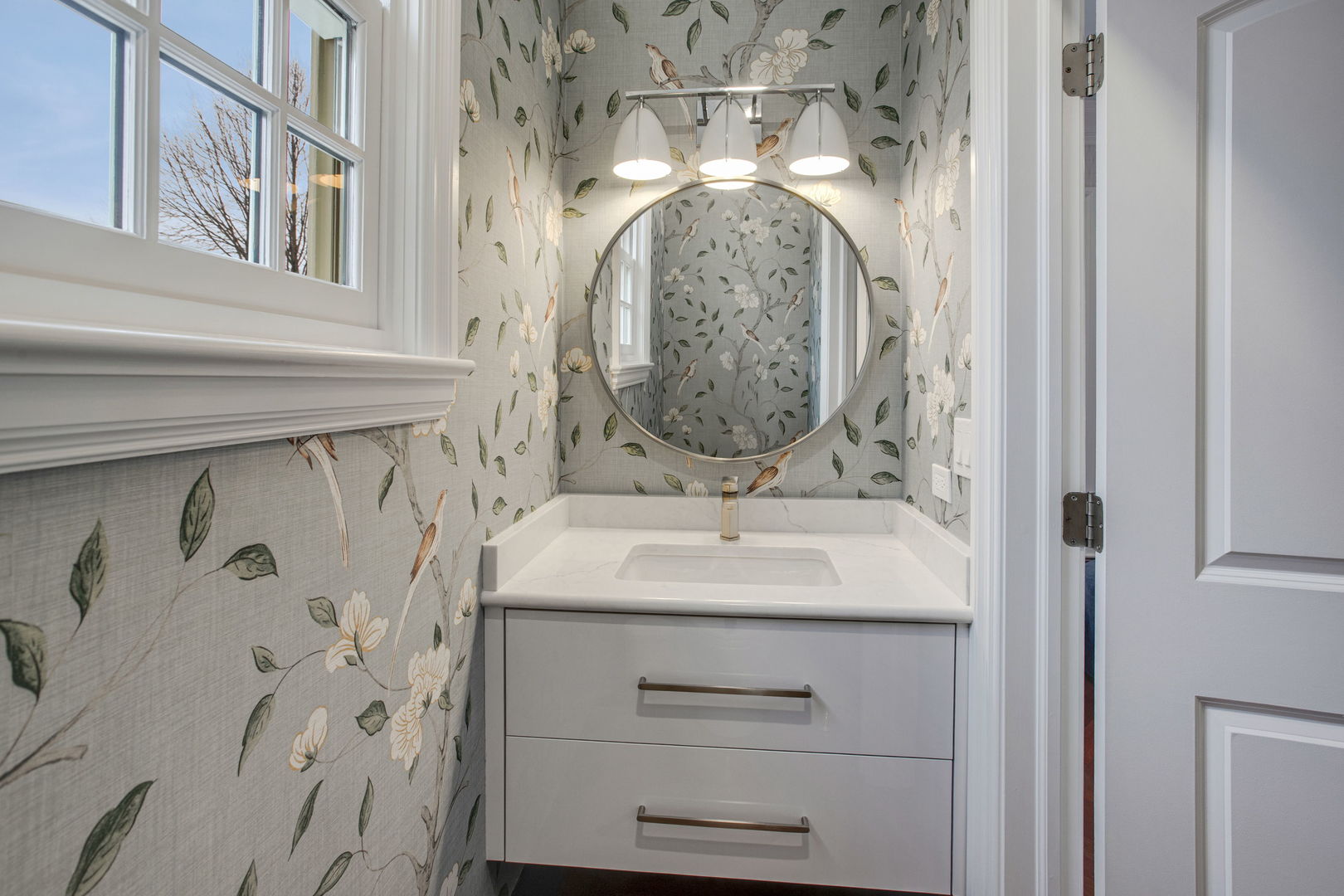 650 South Grove Avenue Barrington, IL 60010 - Photo 18 of 44 a bathroom with a sink and a mirror