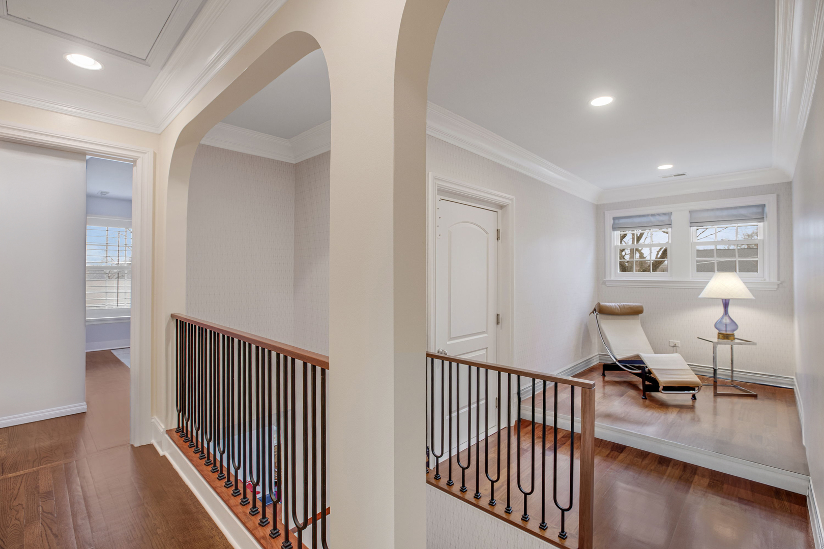 650 South Grove Avenue Barrington, IL 60010 - Photo 19 of 44 a view of a hallway with dining room and wooden floor