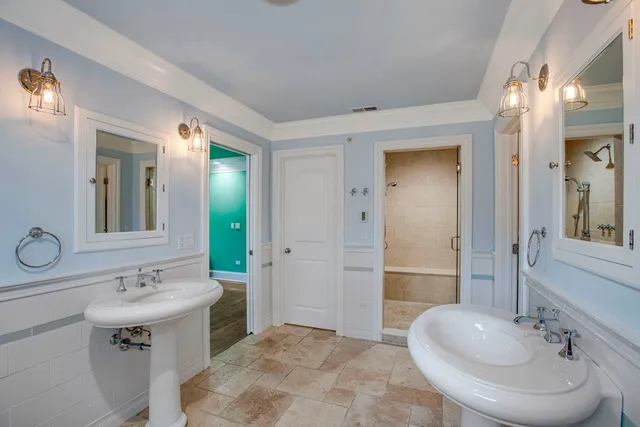a bathroom with a sink double vanity and a mirror