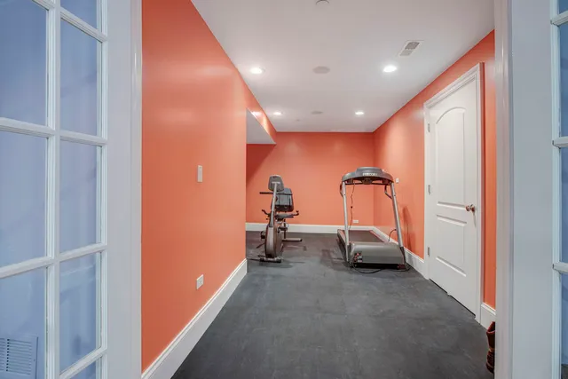 a workspace with furniture bookshelf and a window