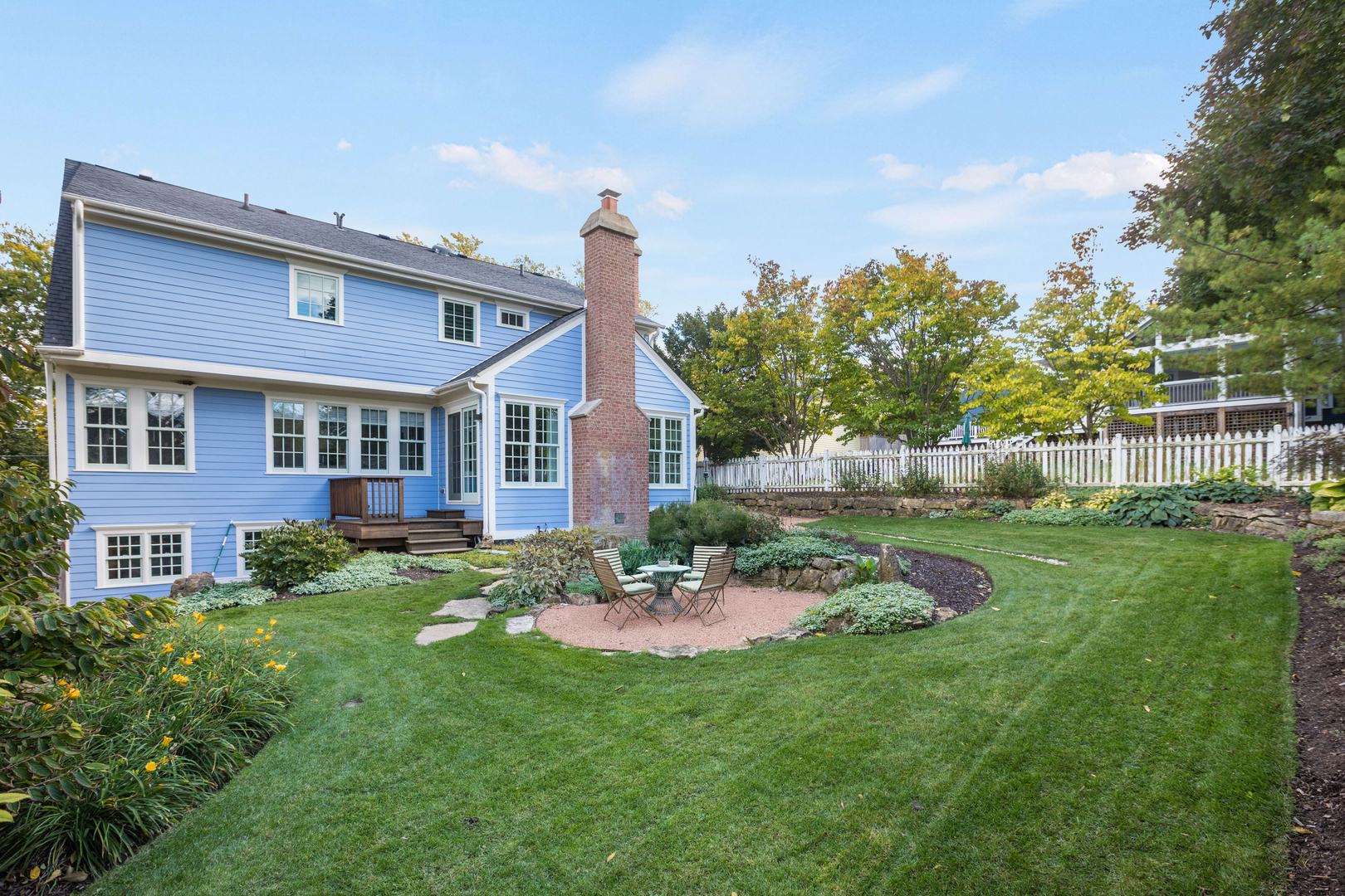 650 South Grove Avenue Barrington, IL 60010 - Photo 39 of 44 a view of a brick house with a big yard and potted plants