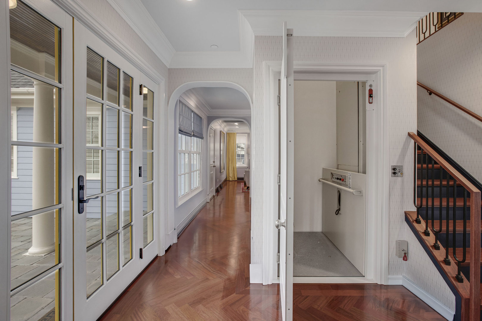 650 South Grove Avenue Barrington, IL 60010 - Photo 5 of 44 a view of a hallway with wooden floor and staircase