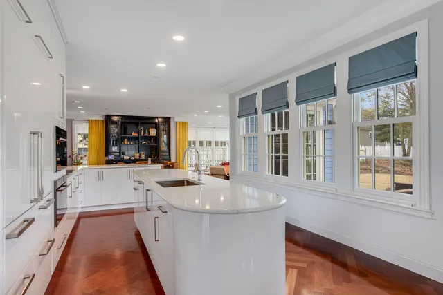 a kitchen with stainless steel appliances granite countertop a sink stove and a refrigerator