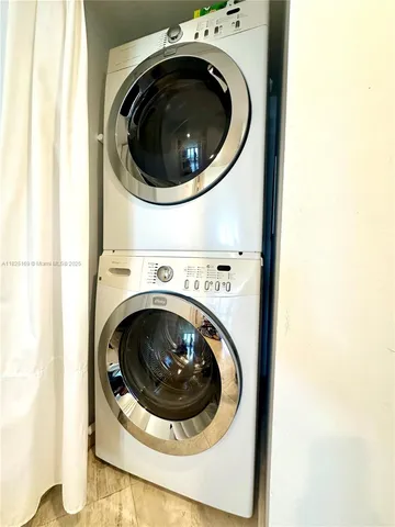 a bedroom with a bed window and a couch