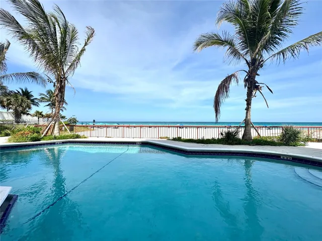 a view of a swimming pool and a lake