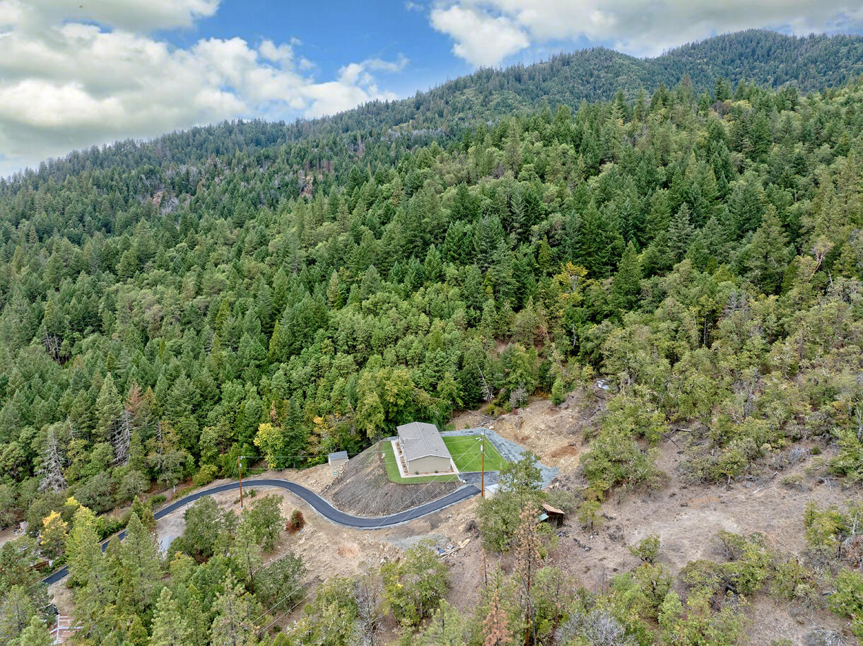 5572 Jumpoff Joe Creek Road Grants Pass, OR 97526 - Photo 29 of 38 a view of an outdoor space and a yard