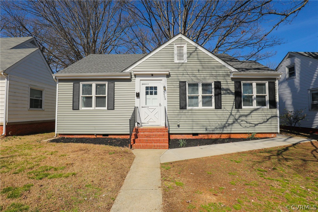 3908 Decatur Street Richmond, VA 23224 - Photo 1 of 23 a front view of a house with a yard