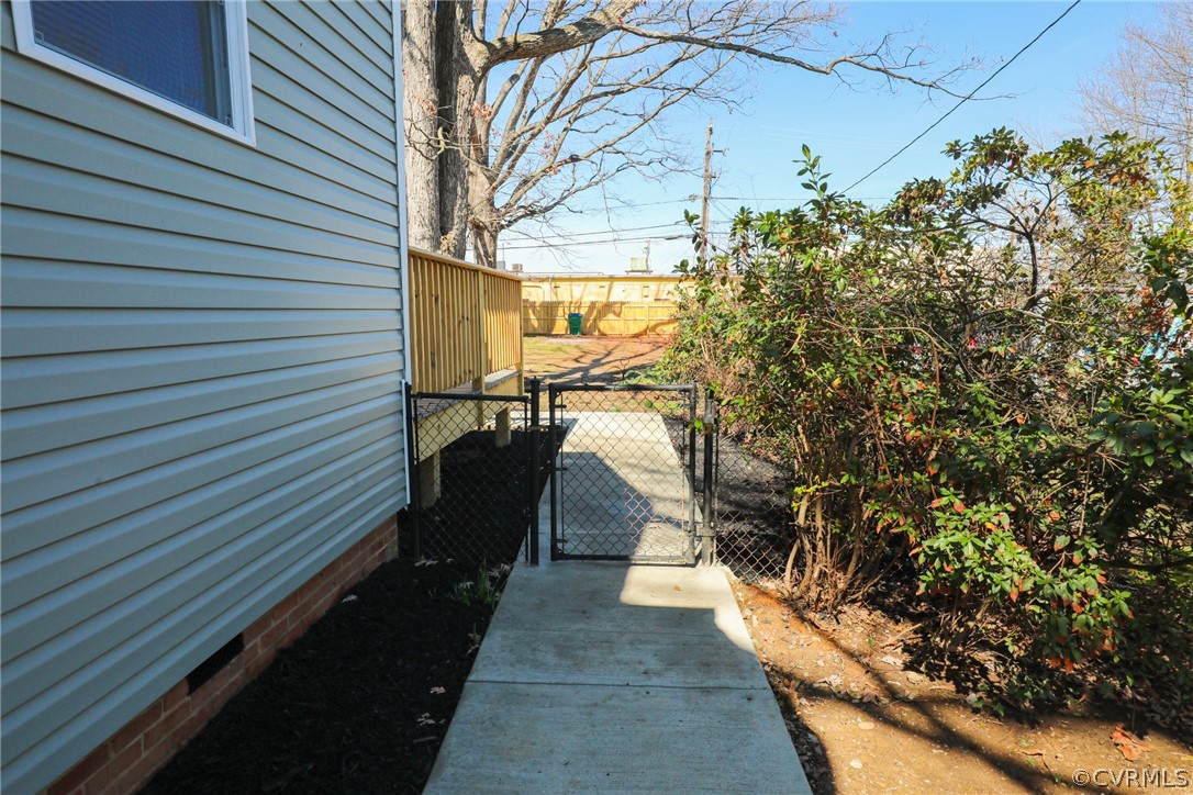 3908 Decatur Street Richmond, VA 23224 - Photo 22 of 23 a view of a pathway of a house with a tree