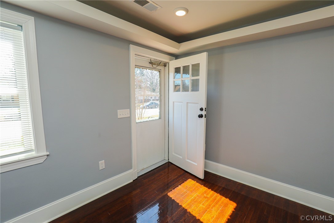 3908 Decatur Street Richmond, VA 23224 - Photo 3 of 23 an empty room with window and wooden floor