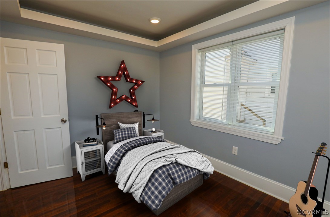 3908 Decatur Street Richmond, VA 23224 - Photo 6 of 23 a bedroom with a bed and wooden floor