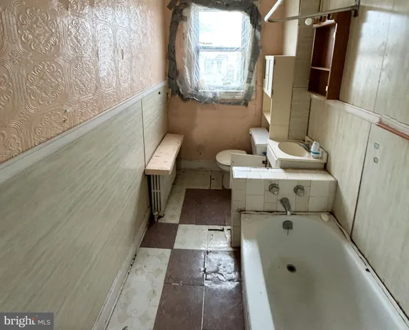a bathroom with a sink and mirror
