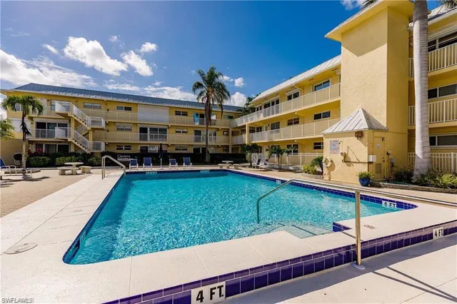 a view of a patio with swimming pool