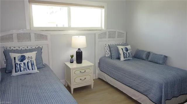 a bed room with a bed and a night stand