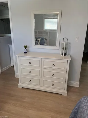a bathroom with a mirror and a sink