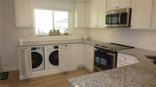 a kitchen with a stove and a microwave