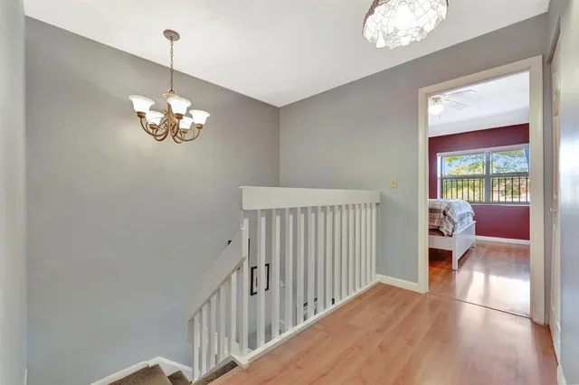 a view of a dining room with furniture large windows and wooden floor