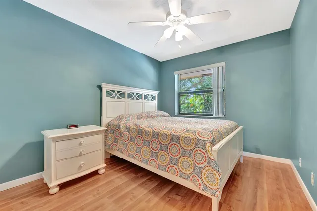 a view of a house with a big yard and potted plants