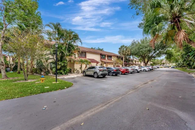 an aerial view of a house with a yard swimming pool and outdoor seating