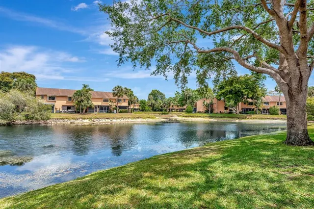 swimming pool view with a seating space