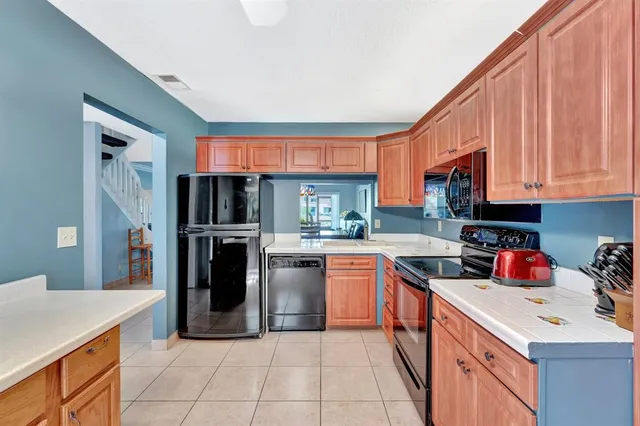 a bathroom with a toilet sink vanity and mirror