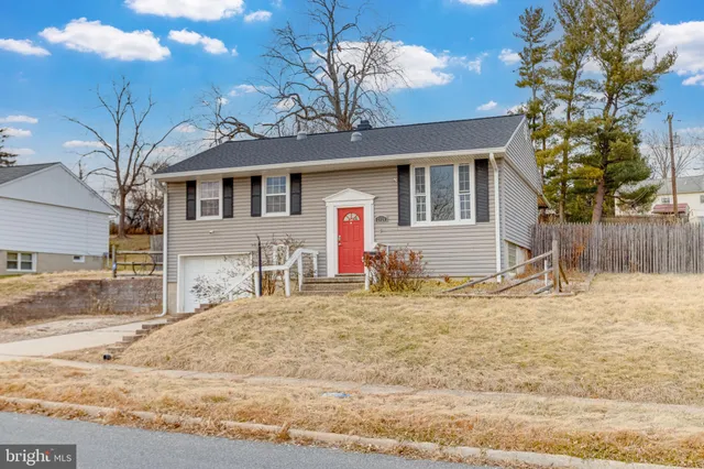 a view of a house with a snow on the road