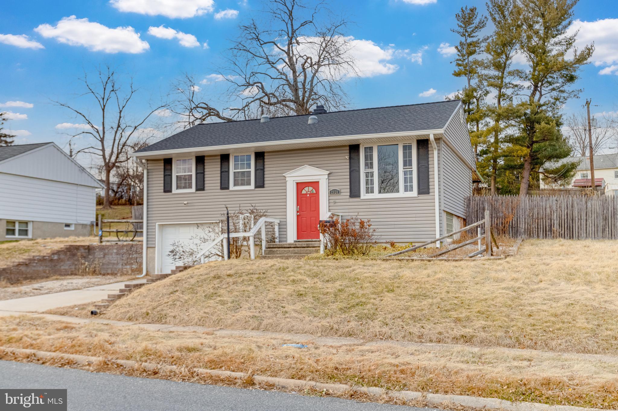 a view of a house with a snow on the road