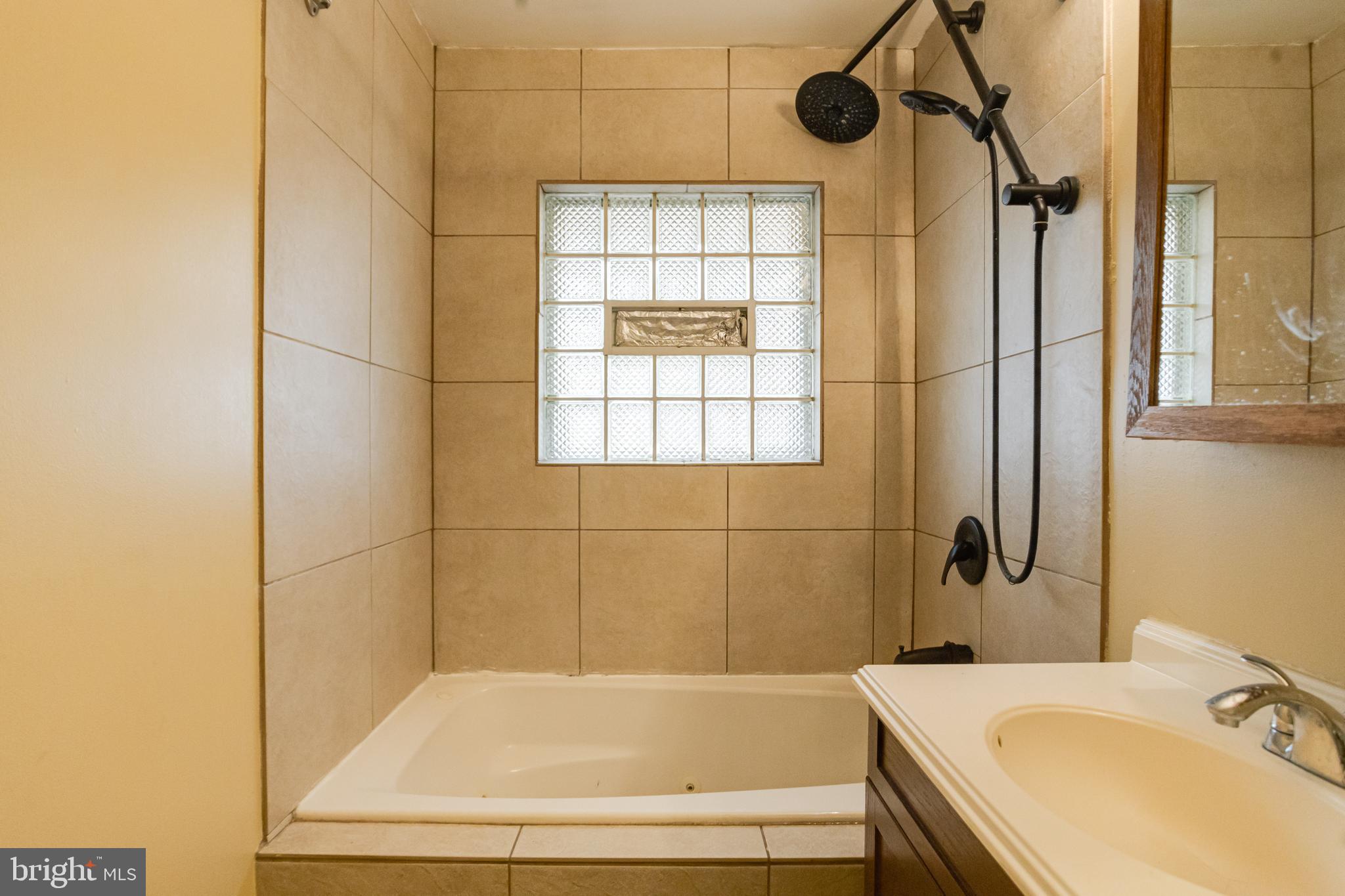 2020 Hanson Road Edgewood, MD 21040 - Photo 23 of 34 a bathroom with a granite countertop sink a toilet and shower