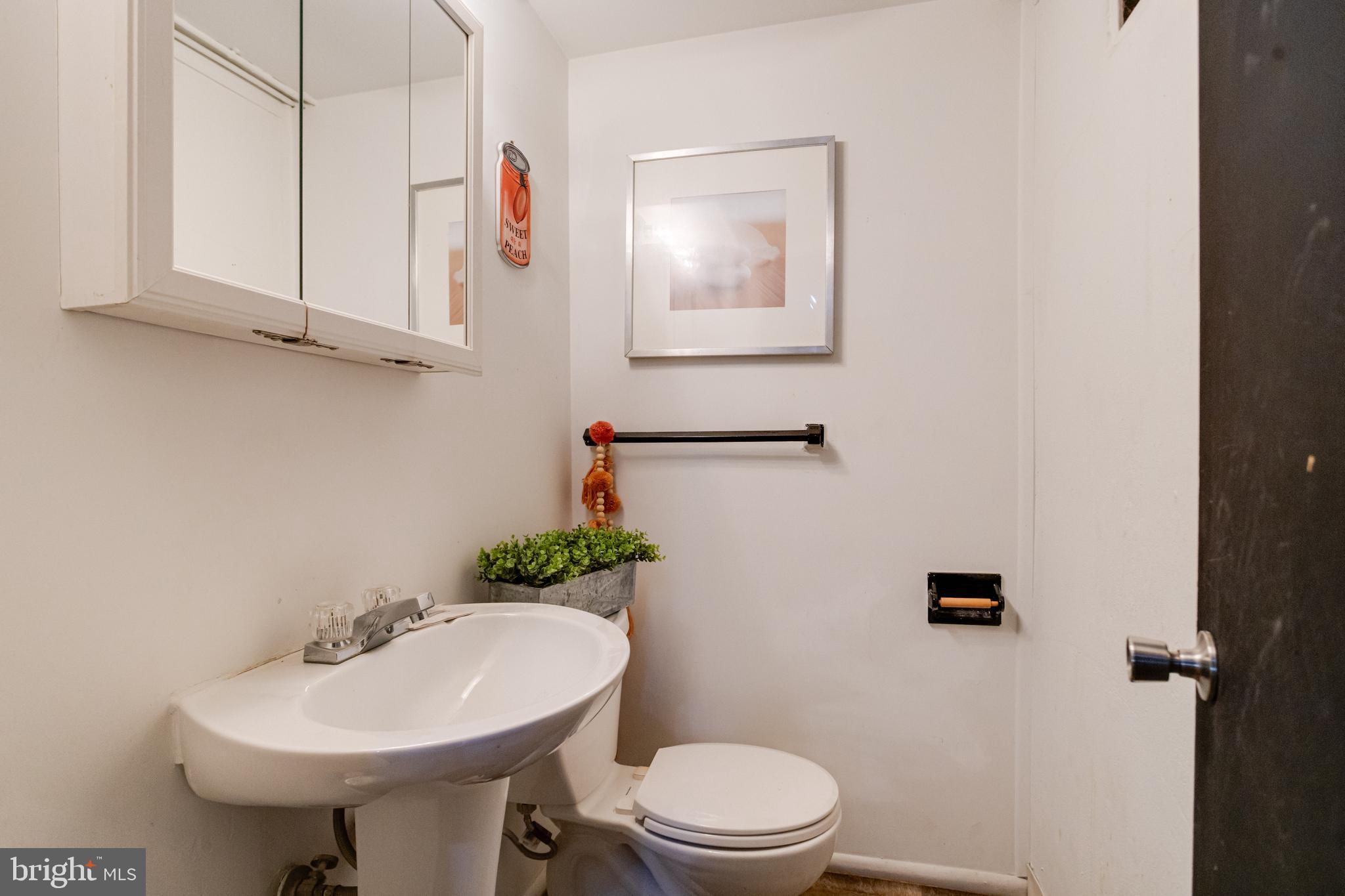 2020 Hanson Road Edgewood, MD 21040 - Photo 28 of 34 a bathroom with a sink a toilet and mirror