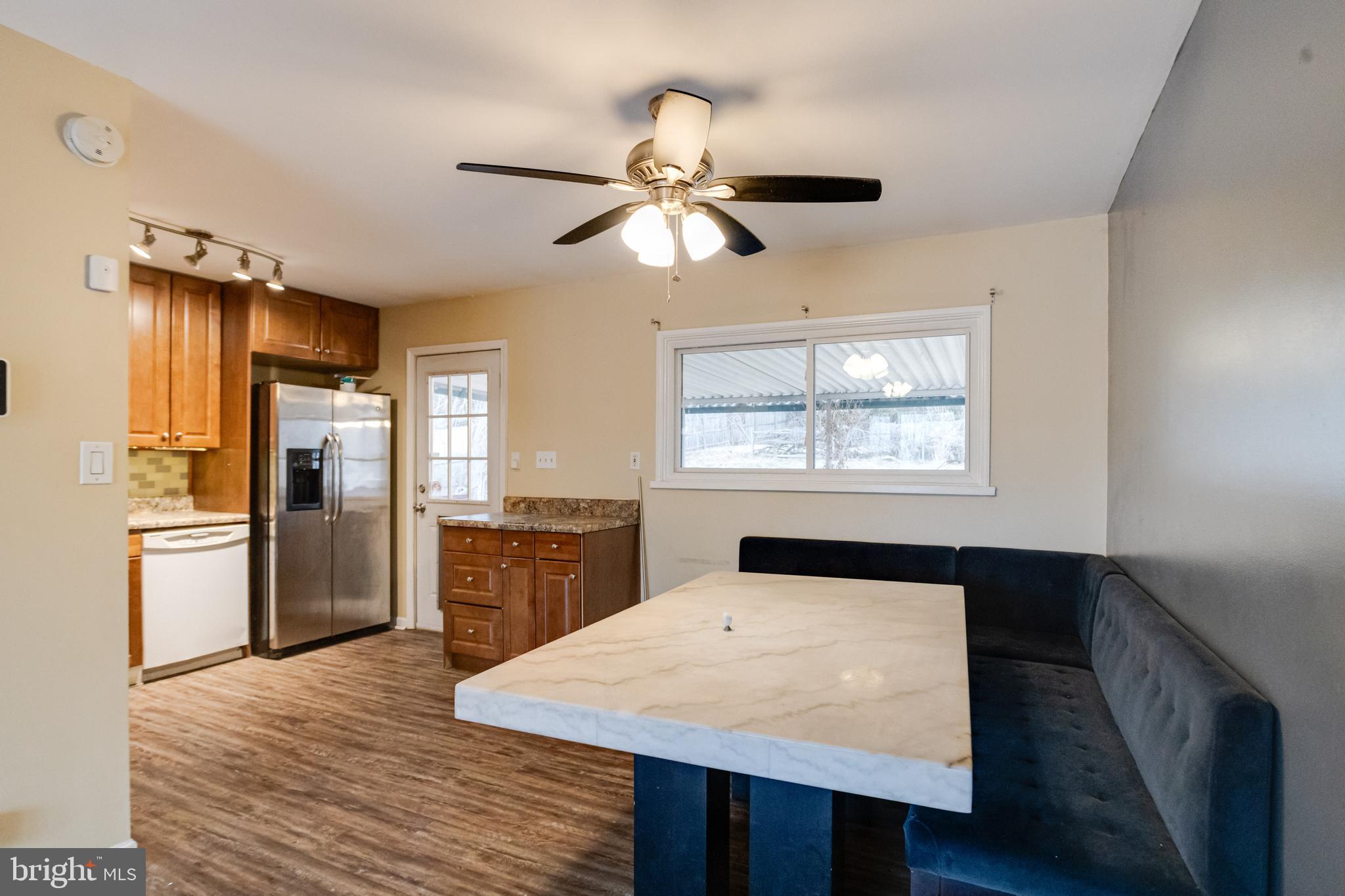 2020 Hanson Road Edgewood, MD 21040 - Photo 10 of 34 a kitchen with a table chairs refrigerator and cabinets