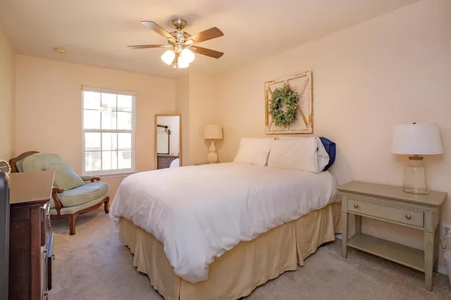 a bedroom with a bed and a table