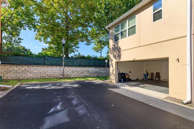 a view of a house with backyard and sitting area