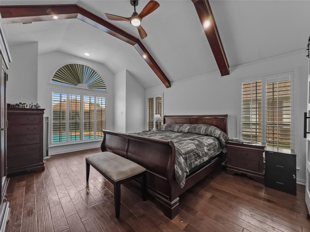 2317 Wellesly Road Rowlett, TX 75089 - Photo 16 of 39 a bed sitting in a bedroom next to a window