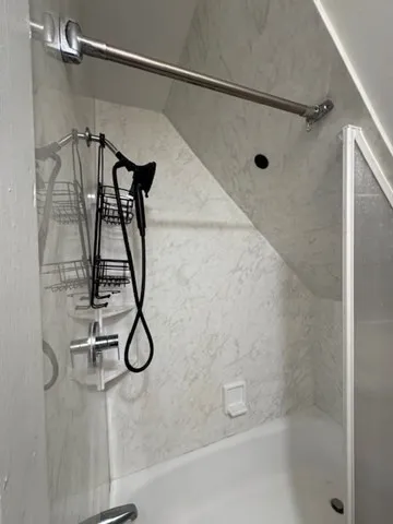 a bathroom with a sink toilet and a mirror