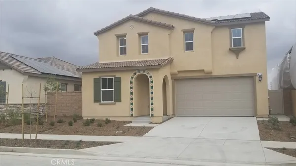 a view of a house with a parking area