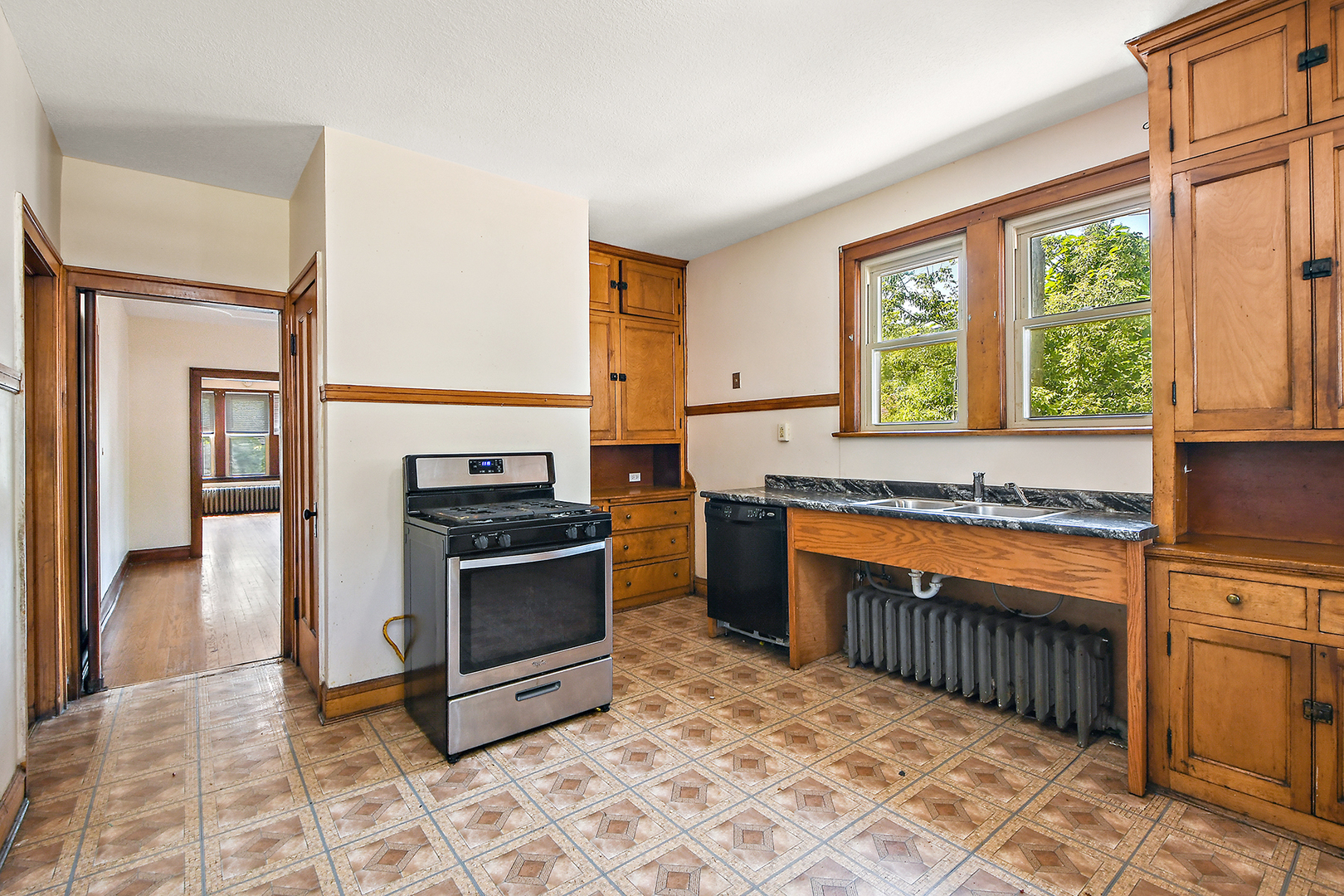 2540 Lewis Street Blue Island, IL 60406 - Photo 11 of 27 a kitchen with stainless steel appliances granite countertop a stove a sink and a microwave