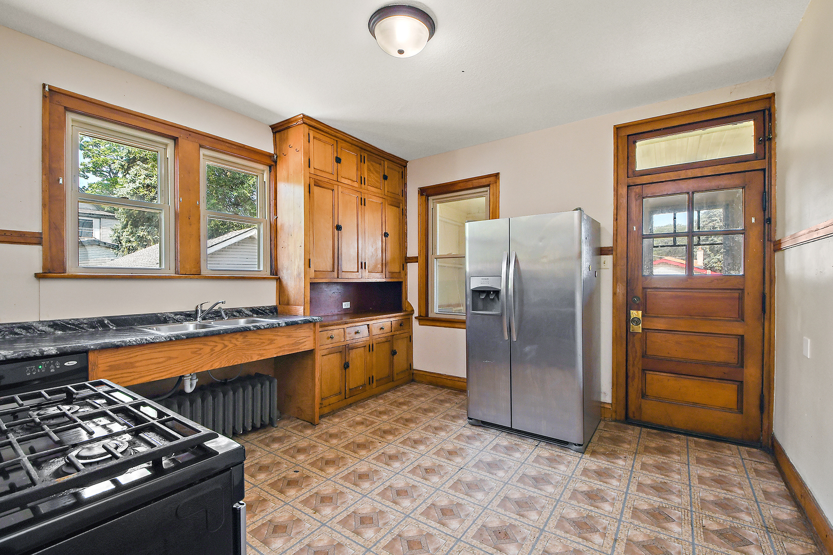 2540 Lewis Street Blue Island, IL 60406 - Photo 12 of 27 a kitchen with stainless steel appliances granite countertop a refrigerator a stove and a cabinets