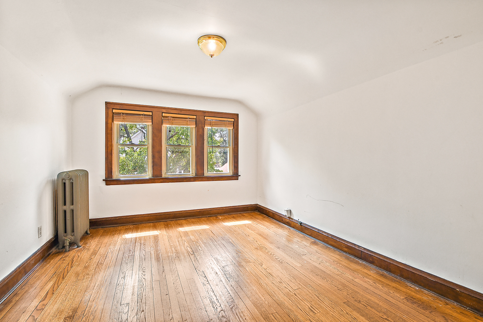 2540 Lewis Street Blue Island, IL 60406 - Photo 13 of 27 an empty room with wooden floor and windows