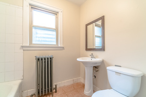 2540 Lewis Street Blue Island, IL 60406 - Photo 15 of 27 a bathroom with a toilet sink and mirror