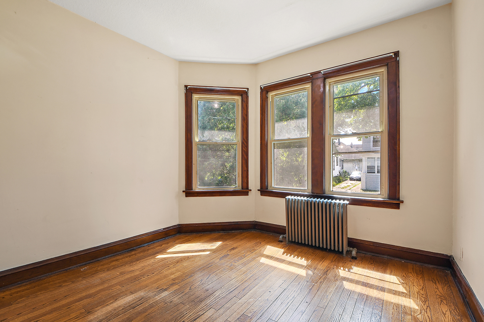 2540 Lewis Street Blue Island, IL 60406 - Photo 17 of 27 an empty room with wooden floor and windows